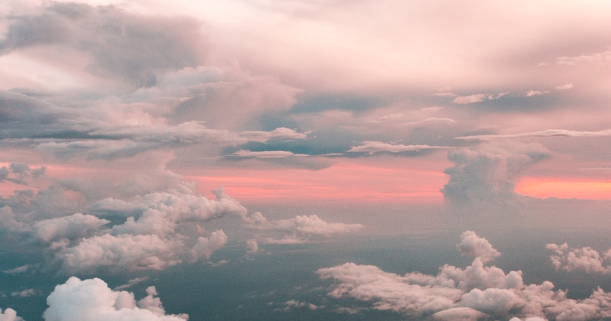 Layered pastel clouds at sunset with soft pink and grey blending across the sky — cocaine recovery is built more from steady daily practice than from any dramatic single intervention