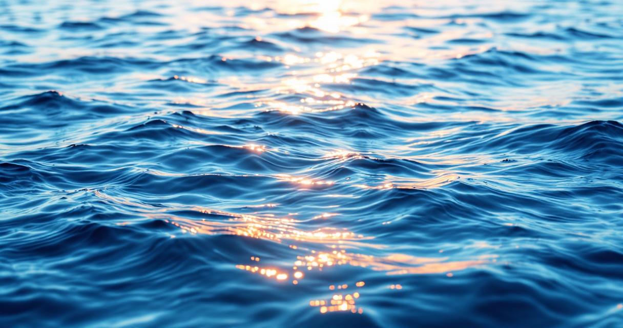 Abstract serene landscape of calm still water overlooking a soft ocean horizon at sunset, a sense of upscale tranquility