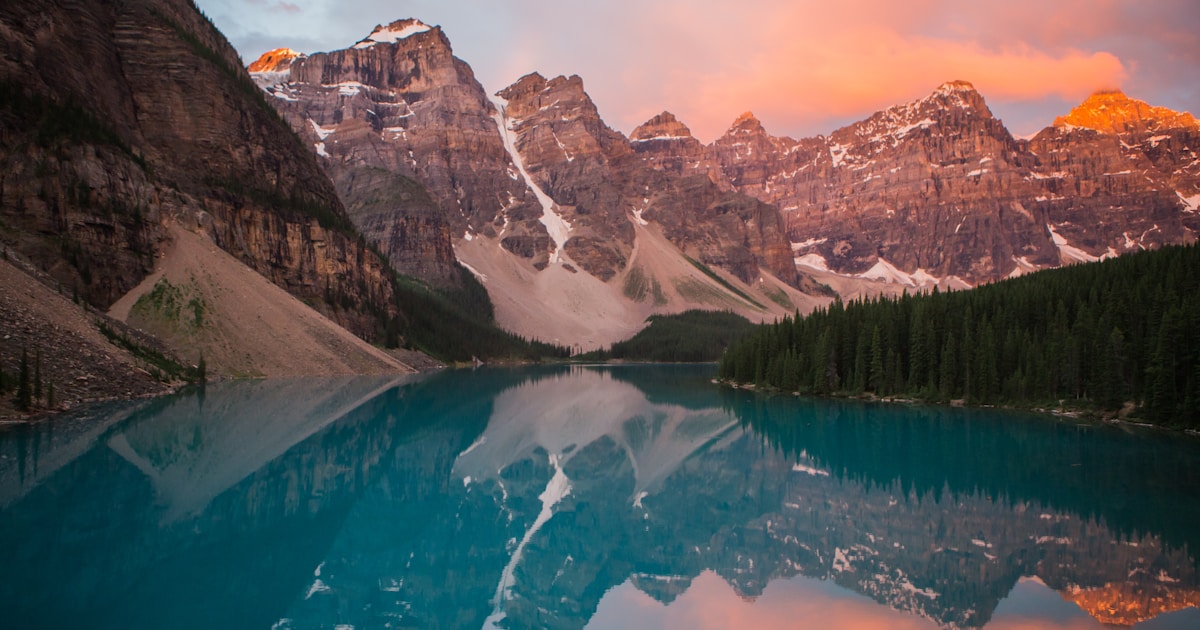 Abstract watercolor of a still mountain lake mirroring peaks at sunrise — the steady, self-directed clarity SMART aims to build